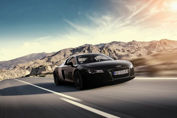 High-speed car on a mountain road in clear weather