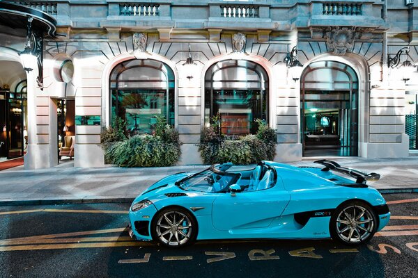 A parked convertible at a luxury store