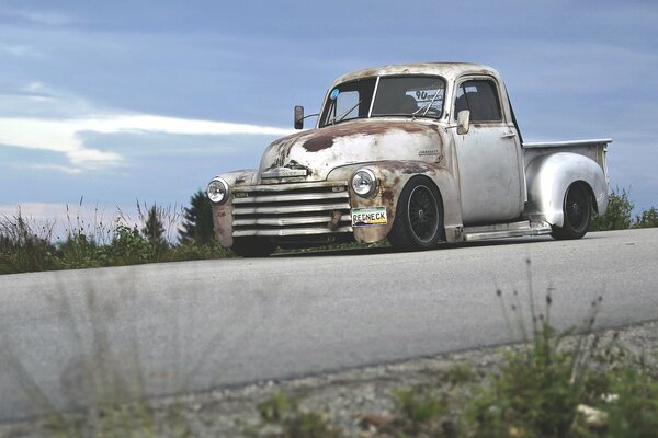 Retro chevrolet pickup truck on the road