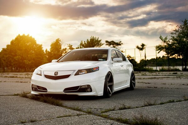 White acura tsx sedan at sunset