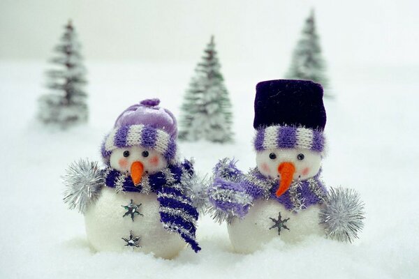 Snowmen put on warm scarves in winter