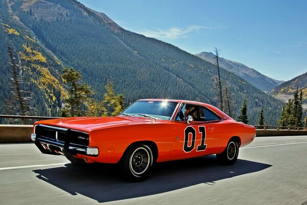 Red sports car on the background of mountains