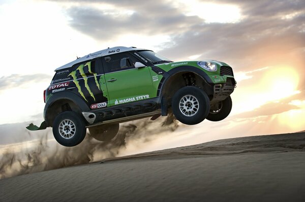 Green mini Cooper conquers the Dakar highway