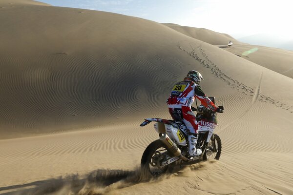 A motorcycle racer. Motorcycle on the sand