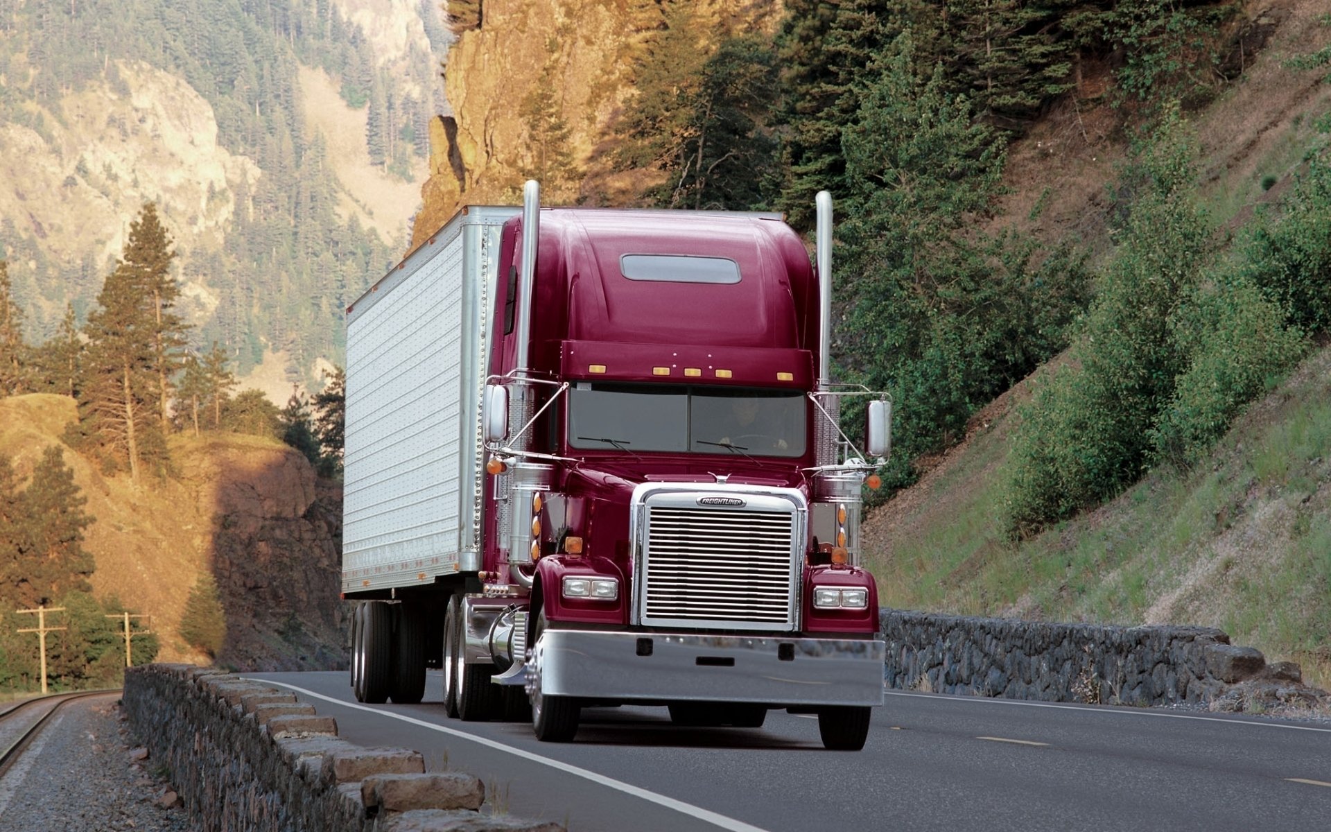 freightliner classic freightliner classic truck tractor truck track front end road forest trees mountain