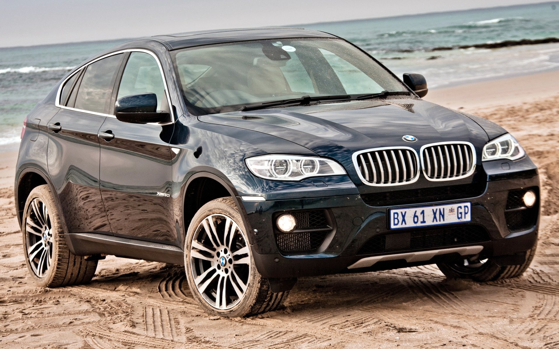 bmw x6 xdrive50i bmw x6 jeep anteriore blu spiaggia.sabbia orizzonte disseminato