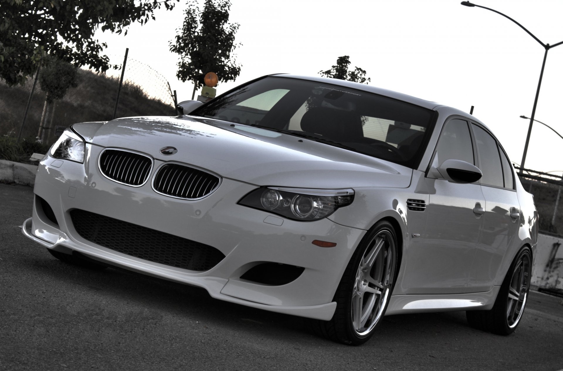 bmw m5 e60 white evwning bmw sedan front view road lights tree