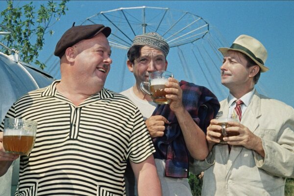 People from comedy posing with beer