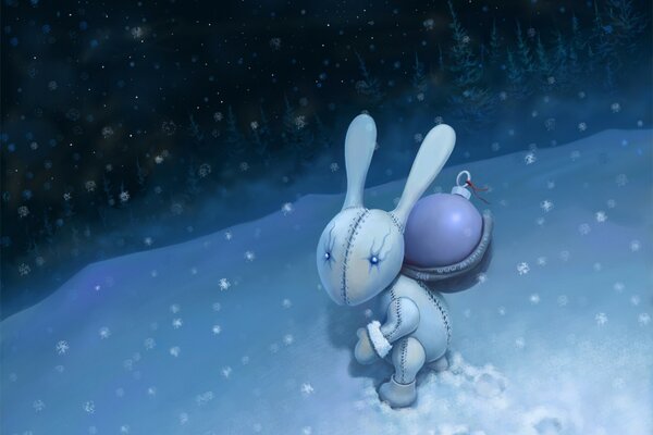 Zaszyty króliczek z noworoczną zabawką idzie po śniegu
