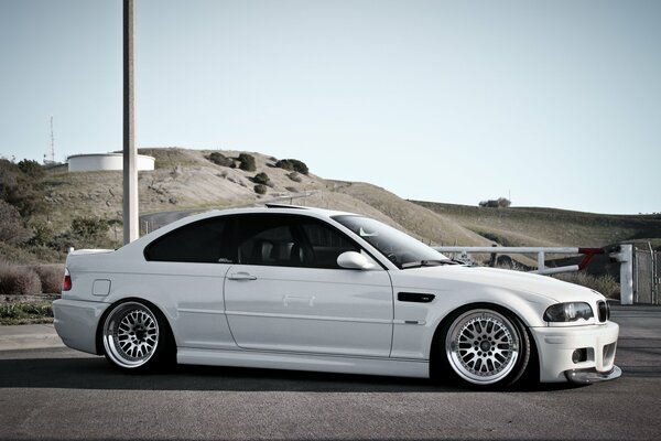 White BMW 3 series E46 body outside the city