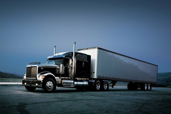 Big truck on the sky background