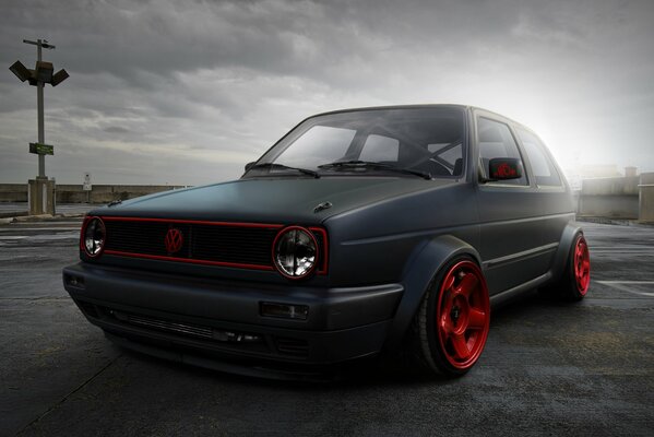 Volkswagen golf with red wheels