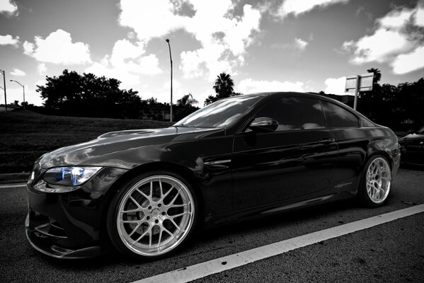 Black bmw m3 on the highway in the evening