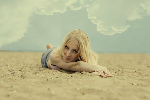 A girl on a sandy beach, a beauty