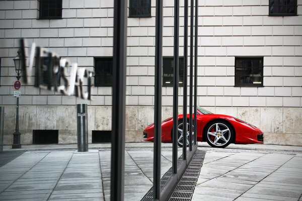 Mirror wall. Reflection of ferrari 458 italia