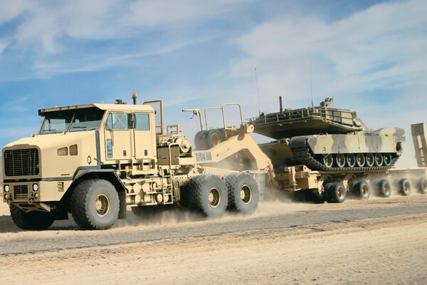 The tank is transported along a deserted road