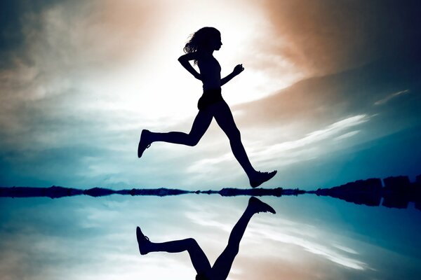 Silhouette and reflection of a running girl