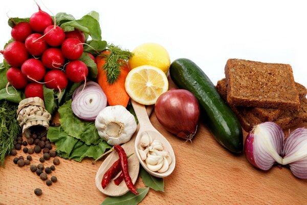 Vegetables and lemon on a wooden table