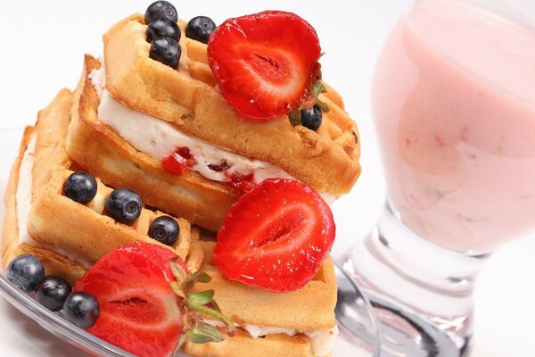 Soft waffles with cream and berries