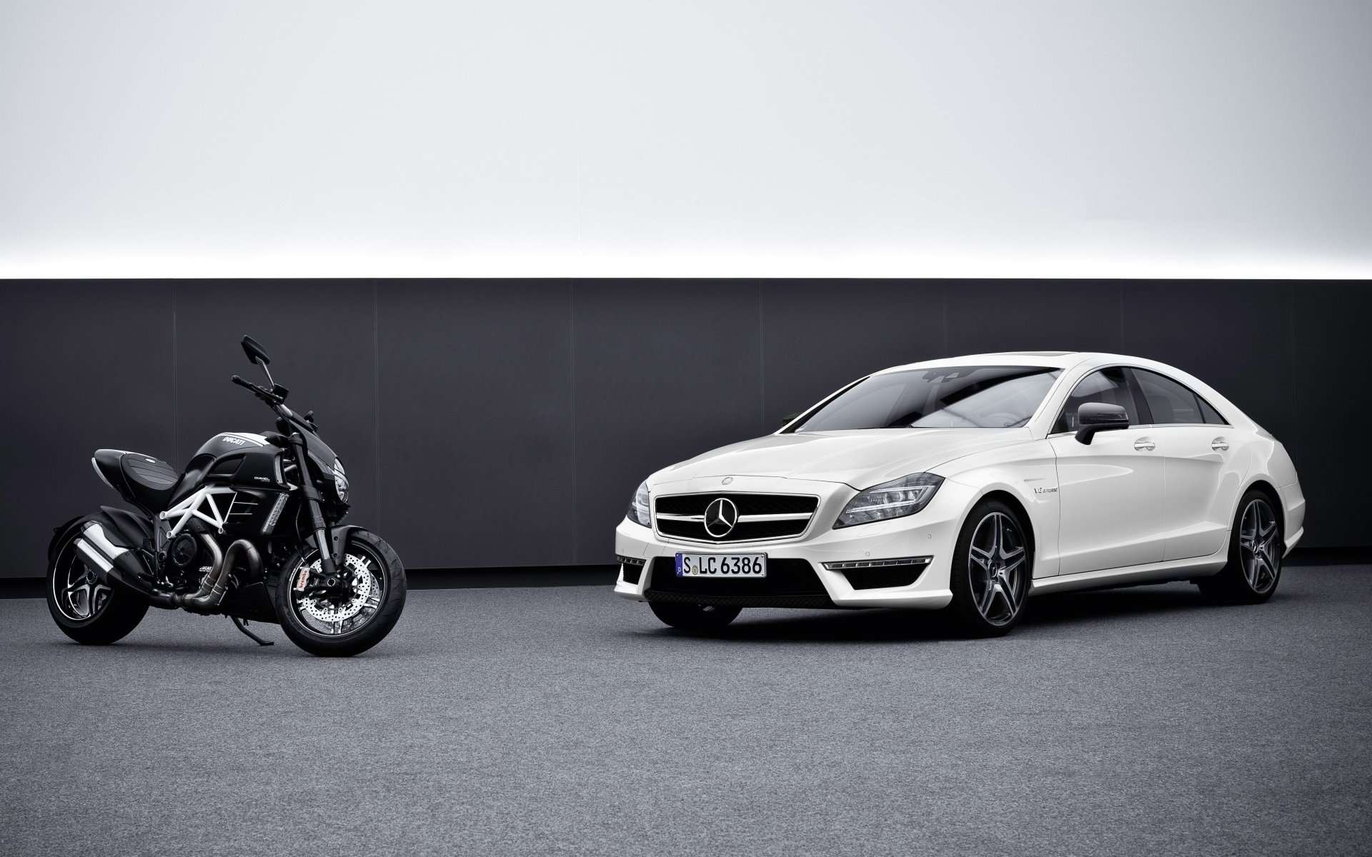 mercedes-benz cls63 amg and ducati diavel mercedes cls63 amg ducati divel front car motorcycle background