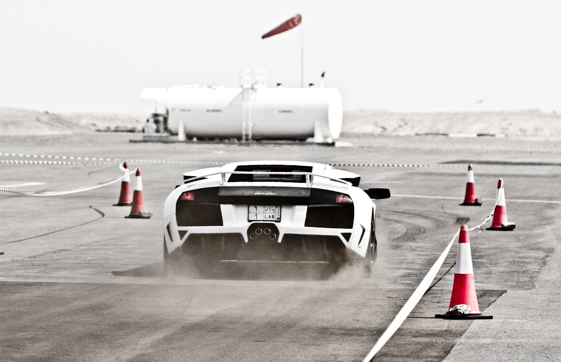 lamborghini murcielago lp640 lamborghini marcelago white highway fence cones dust