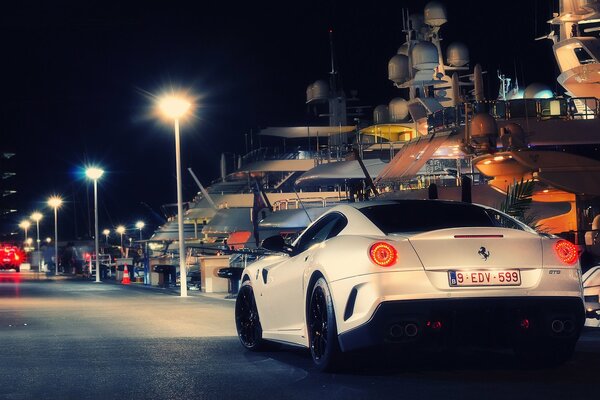 Ferrari in the city rushes towards the lights