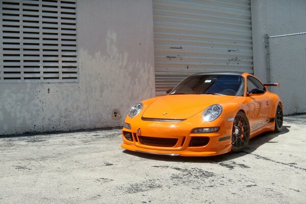 Porsche car at the wall of the building