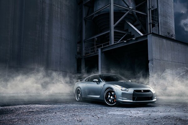 Nissan at a construction site in the dust front view