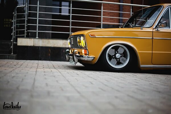 Yellow understated vaz with headlights on