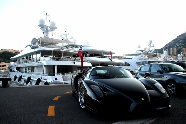 Black Porsche and expensive yacht photography modern style