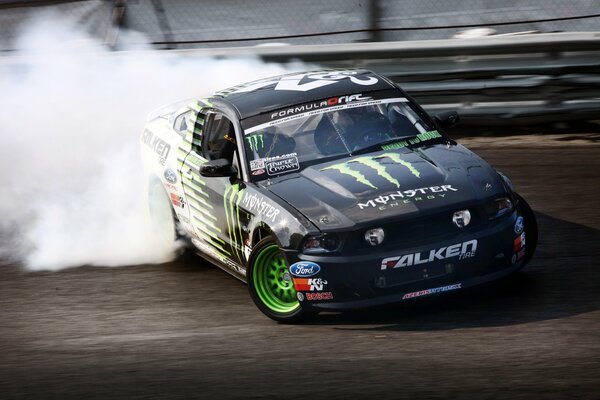 Drift ford mustang racing in a skid