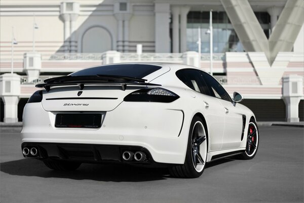 White panamera on the background of a white building