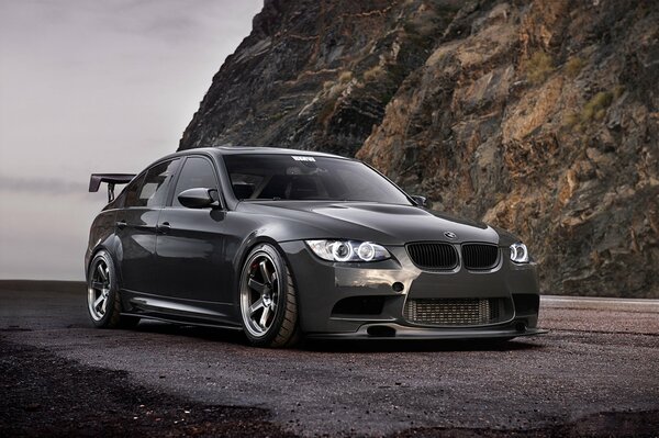 BMW 3 series 335i on a rock background