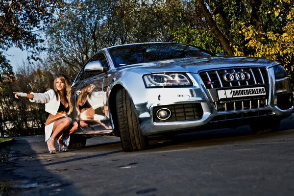 Beautiful girl squatting audi s5