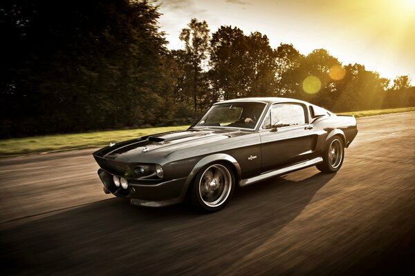 Ford Mustang at speed against the background of the forest