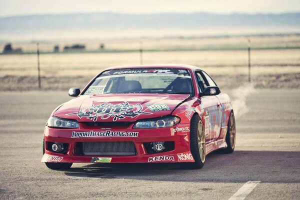 Nissan Sylvia S15 red in rally stickers