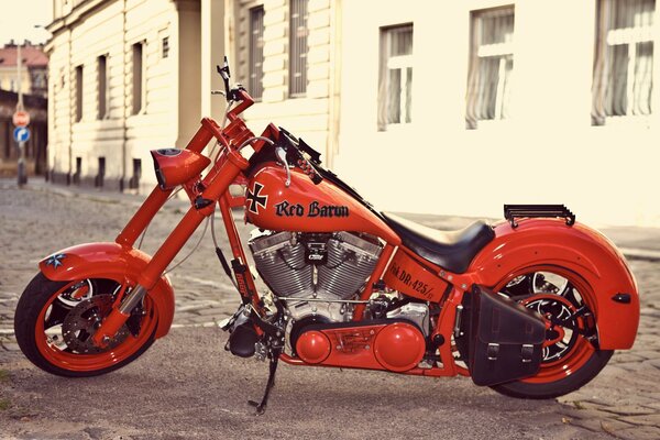 Red motorcycle red baron on the old street