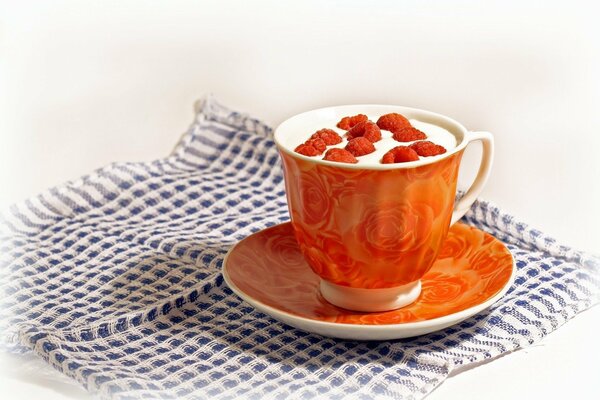 A cup filled with fragrant tea with berries