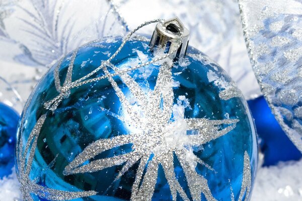 Blue Christmas ball with a shiny snowflake