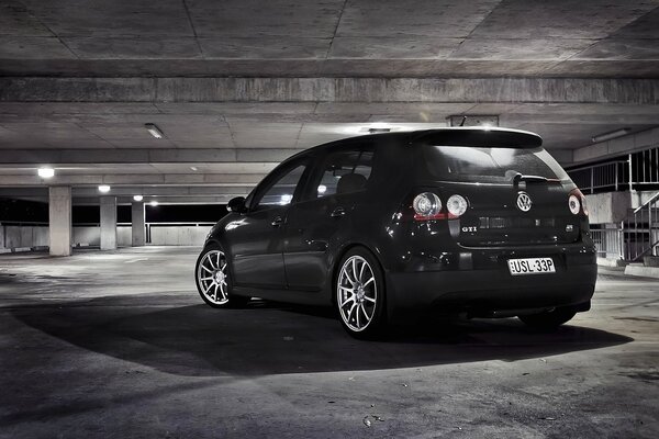 The Volksfagen car is parked in the garage