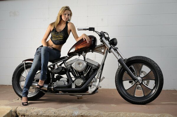 Beautiful girl next to the bike