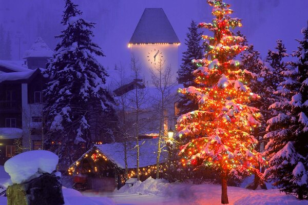 A glowing Christmas tree against the background of others in winter