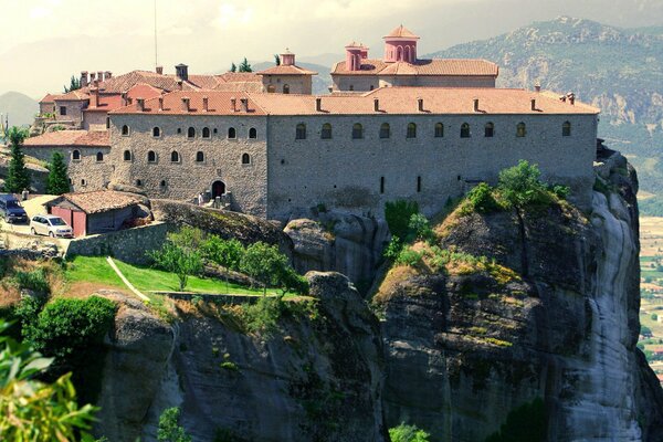 A town on a rock in the mountains