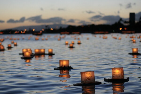 Small lanterns launched on the water