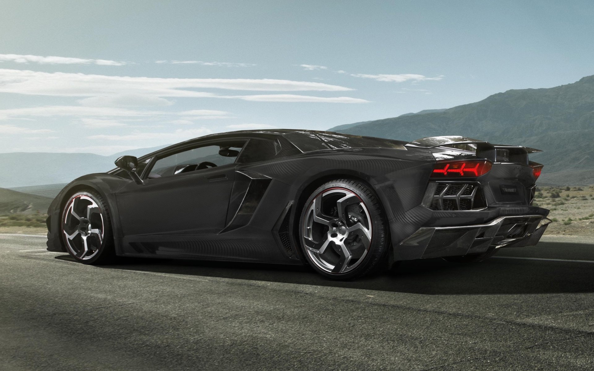 mansory lamborghini aventador lp700-4 carbonado lamborghini aventador supercar rear view tuning carbon sky background