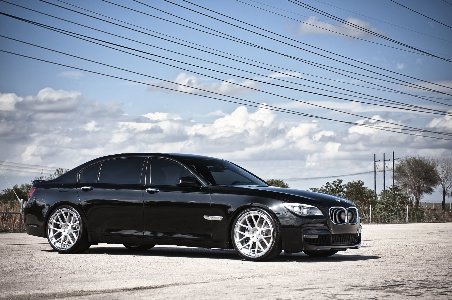 bmw 7 series black 360 three sixty forged bmw high voltage wires sky cloud