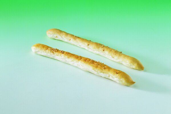 Two breadsticks are on the table