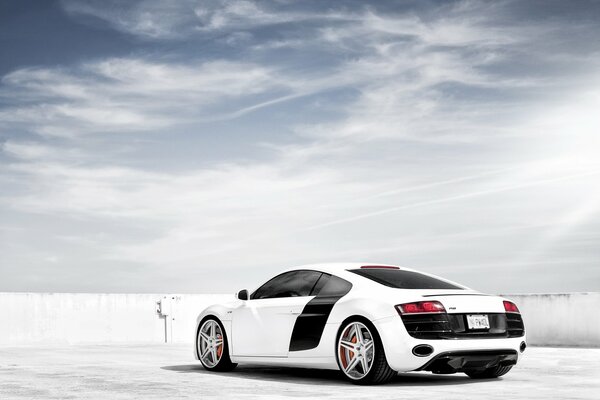 White sports Audi under a clear sky