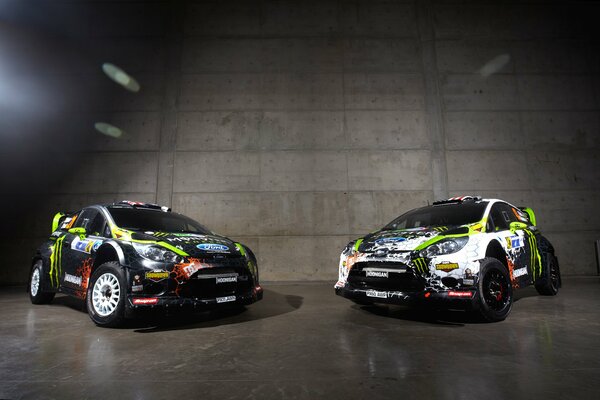 Two Fords in the coloring for the rally in the hangar