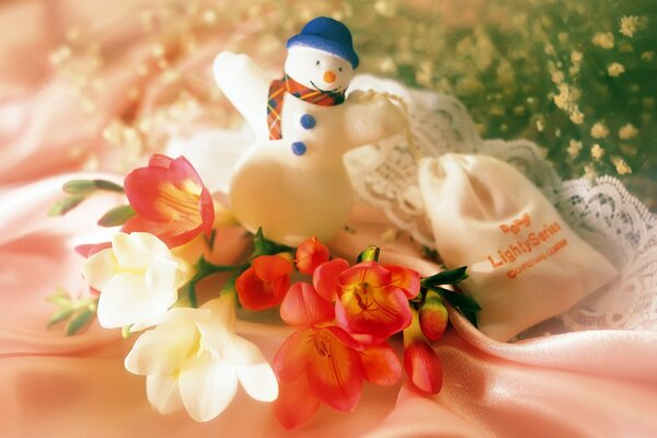 Flores de año nuevo de un muñeco de nieve como regalo